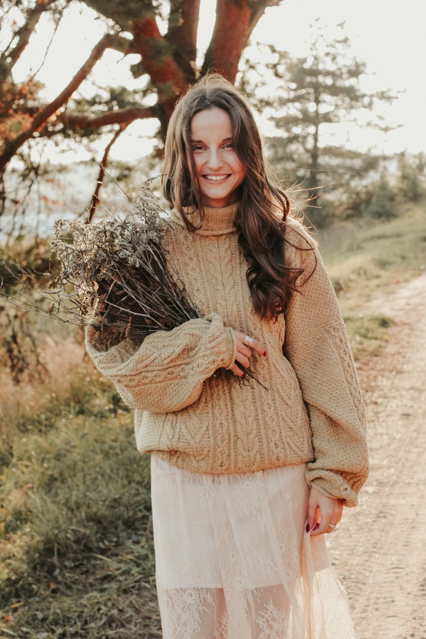 a pretty woman in brown knitted sweater